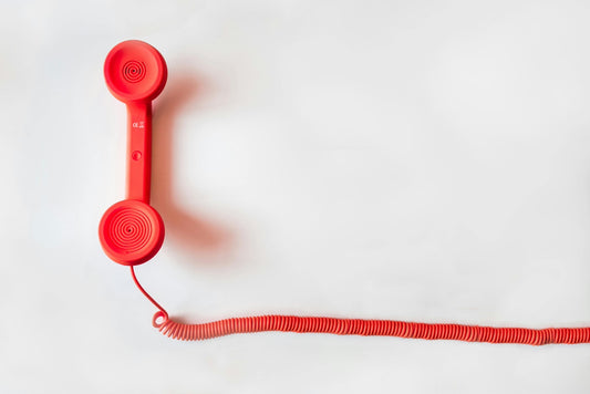 Red telephone with cord