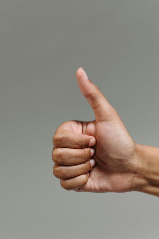 A hand with a thumbs up.