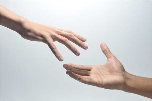 Hands reaching out for one another