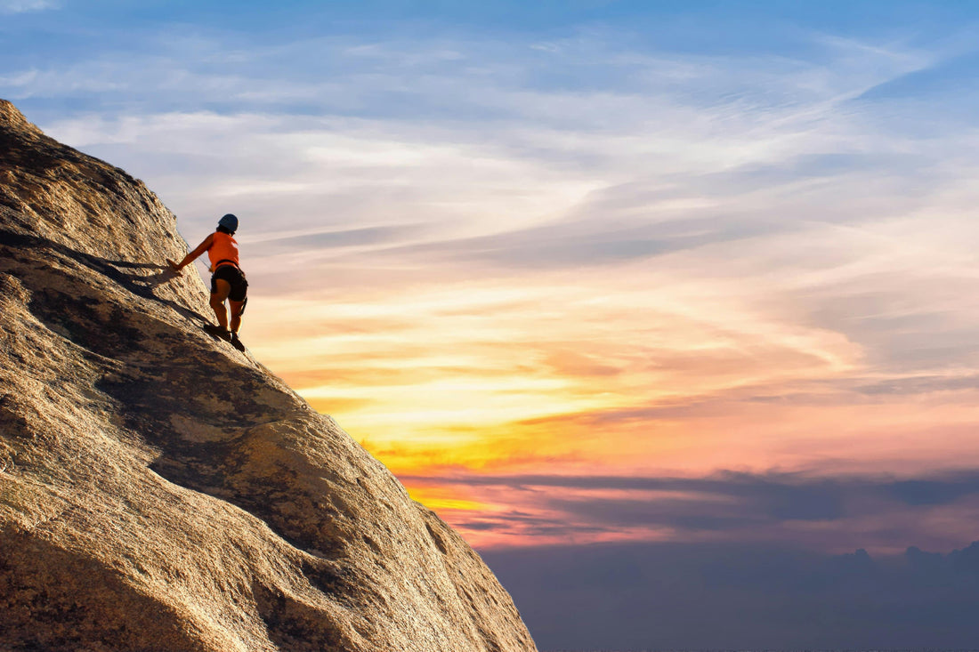 Person climbing a rock